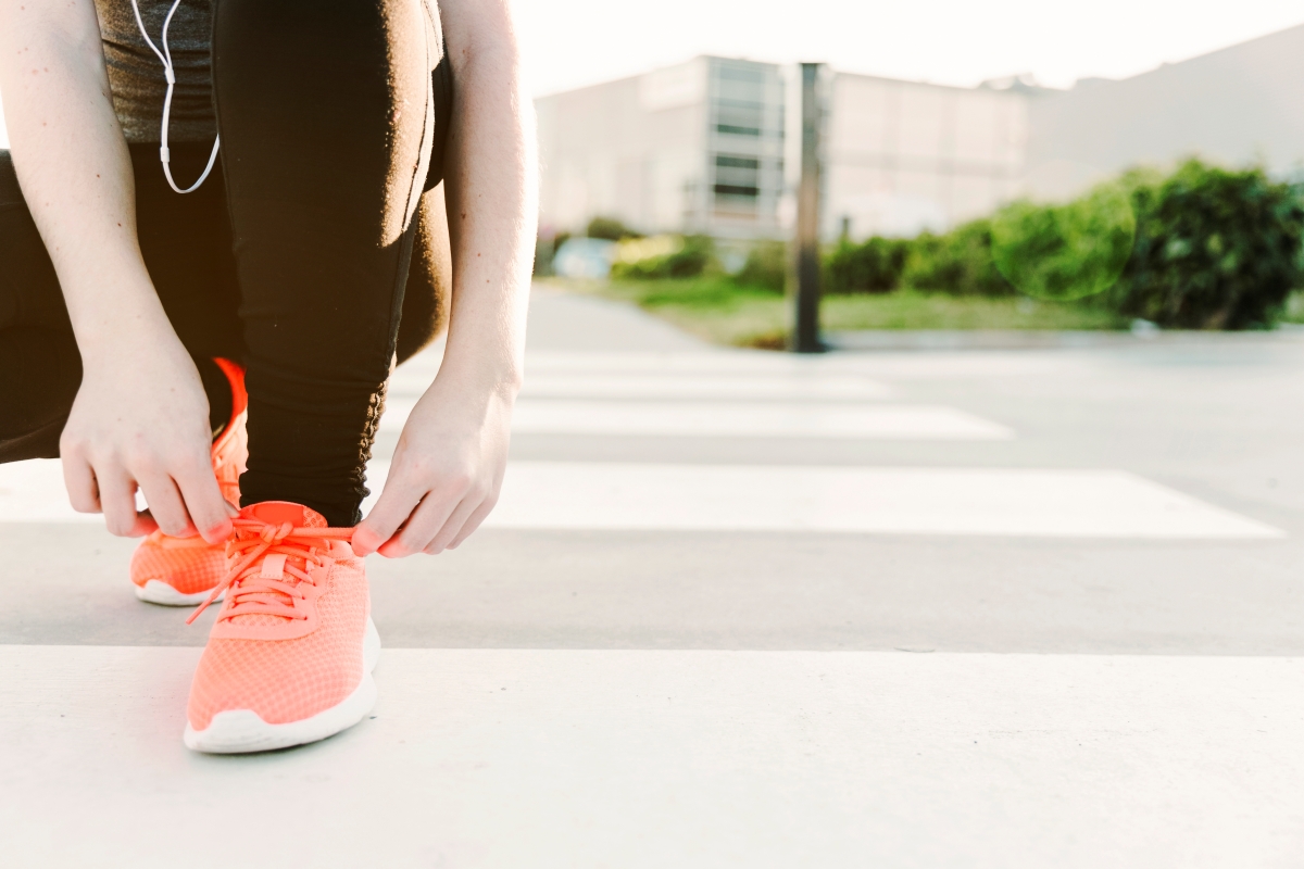 woman-tying-laces-sport-shoes